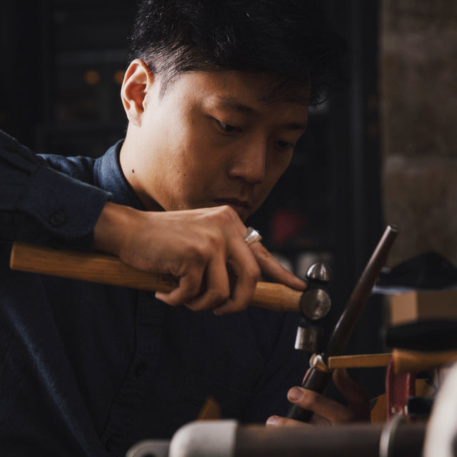 A man making jewellery