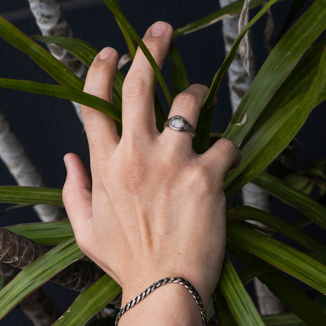 turqoise gemstone silver ring on a finger