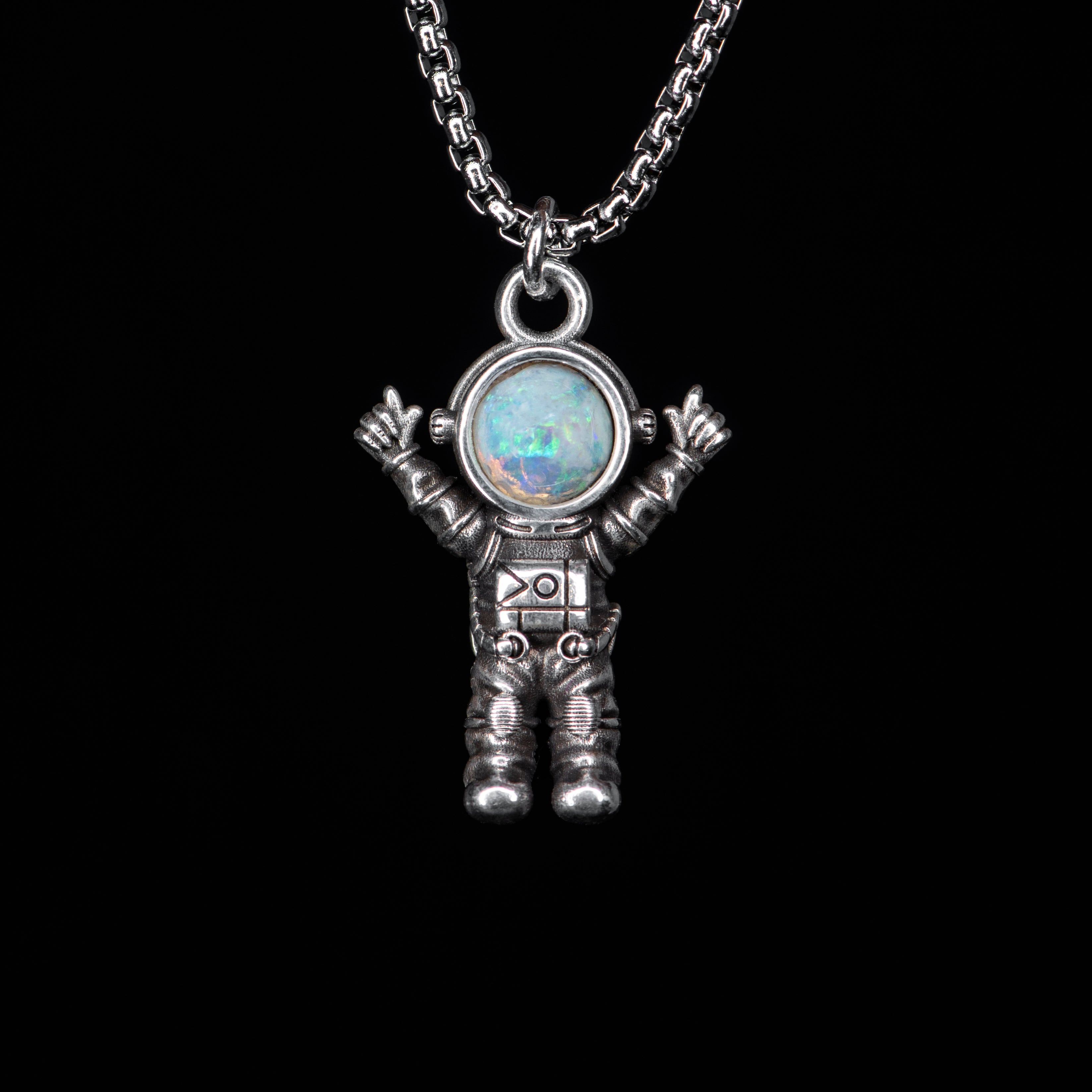 Silver astronaut pendant