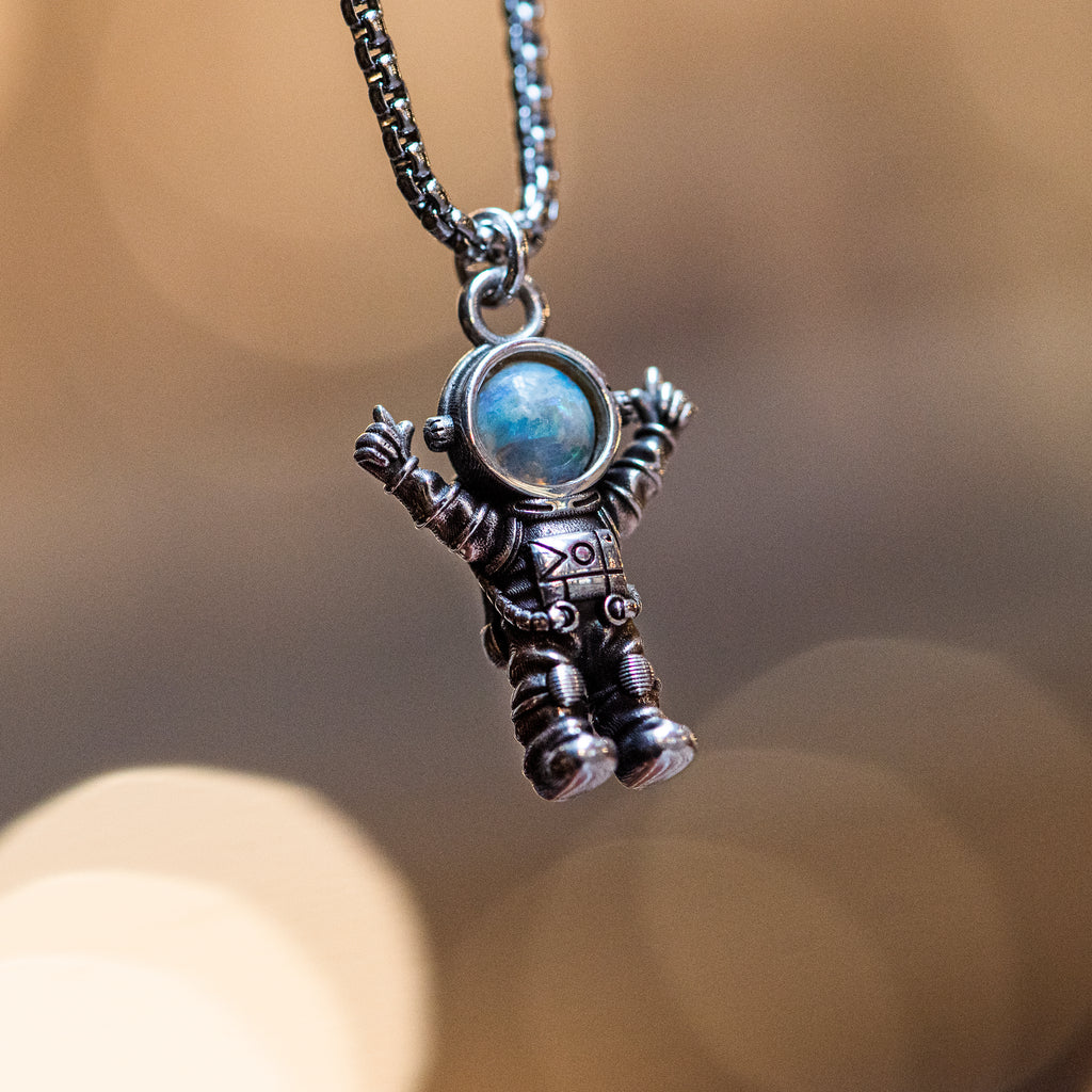silver astronaut necklace