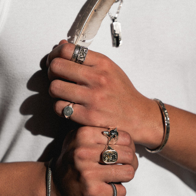 silver wolf ring on a finger