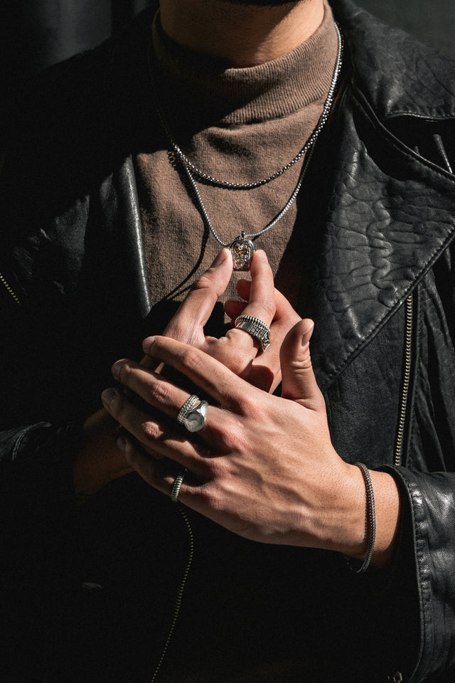 Wearing a silver pendant on a chain