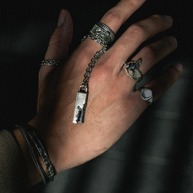 silver wolf ring on a finger
